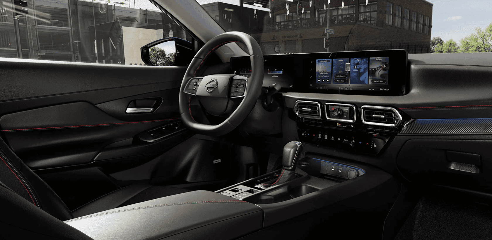 The dash and steering wheel of the 2026 Nissan Sentra.