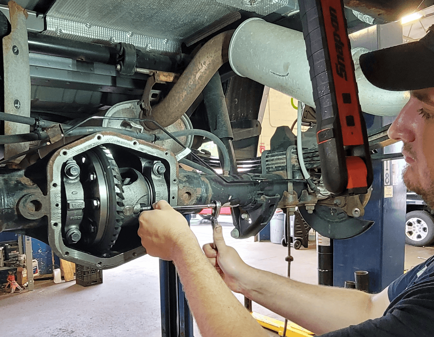 A service person helping a customer and an oil change.