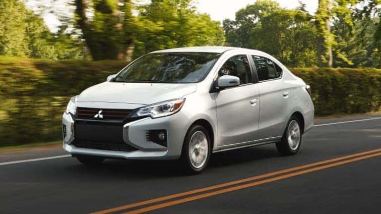 2021 Mitsubishi Mirage in yellow exterior parked in city block