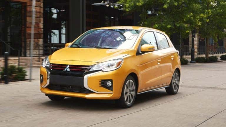 2021 Mitsubishi Mirage in white exterior driving on road
