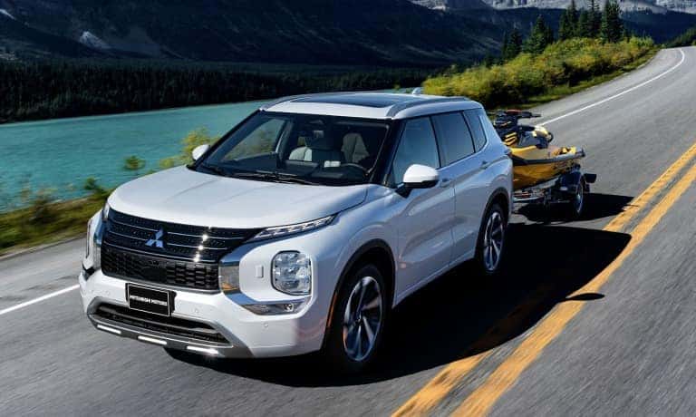 2022 Mitsubishi Outlander towing jetski by river