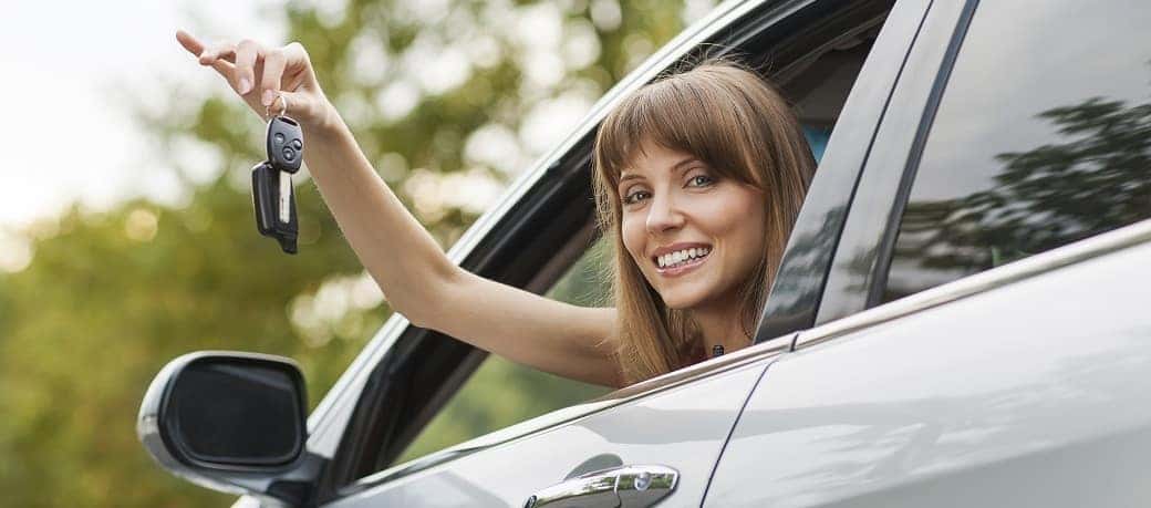 A woman holding keys
