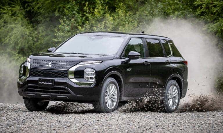 2023 Mitsubishi Outlander PHEV driving on gravel