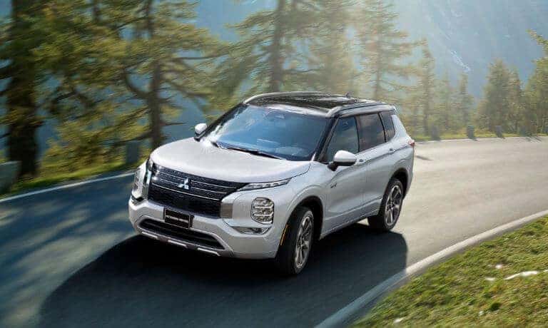 2023 Mitsubishi Outlander PHEV driving fast on turn