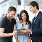 Young couple buys a used Ford at Cox Mazda