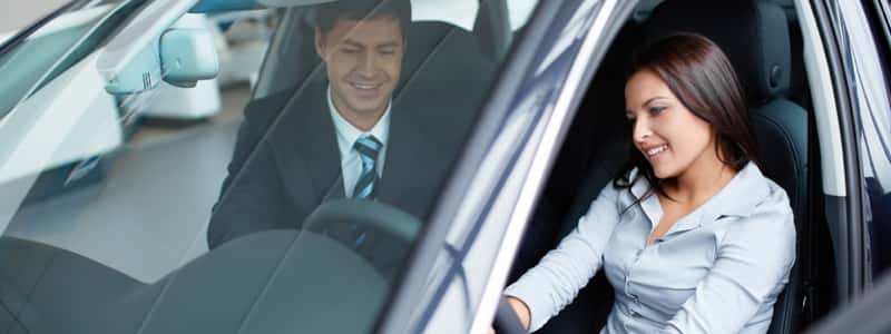 Woman looking at a car 13432825