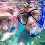 couple snorkeling underwater