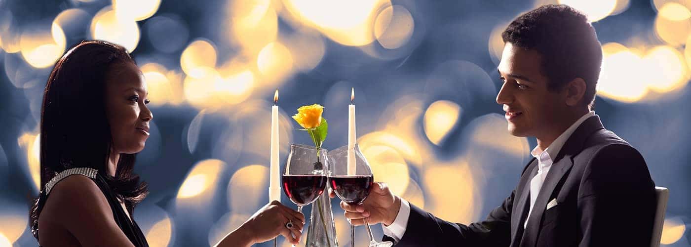 Couple cheers glasses of wine