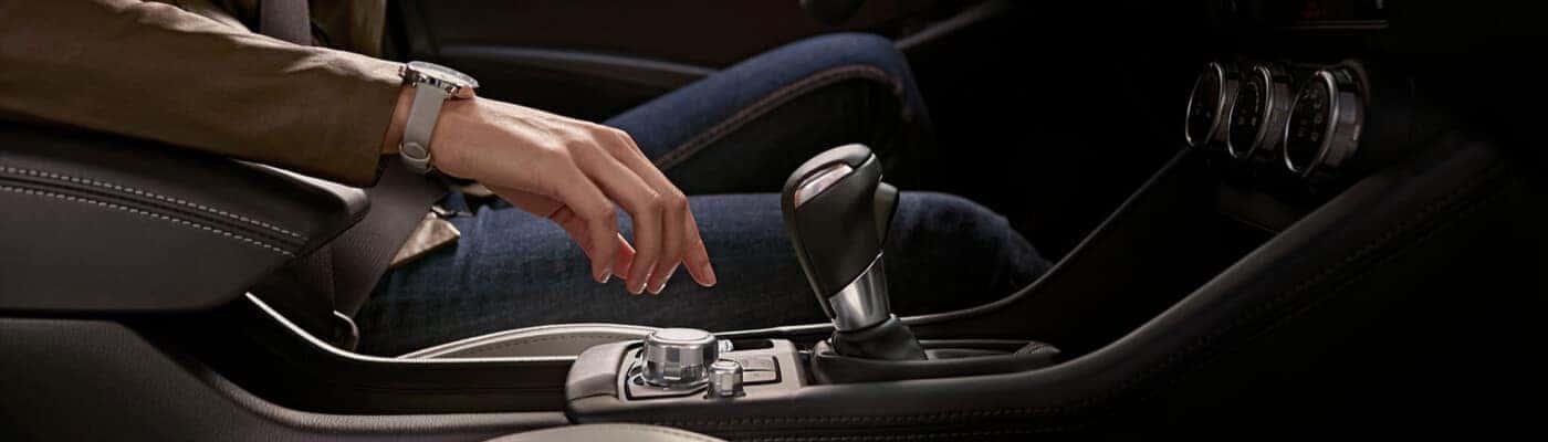 Driver using the dial to change gears