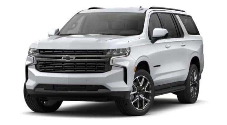 A white 2021 Chevy Suburban RST is angled left.