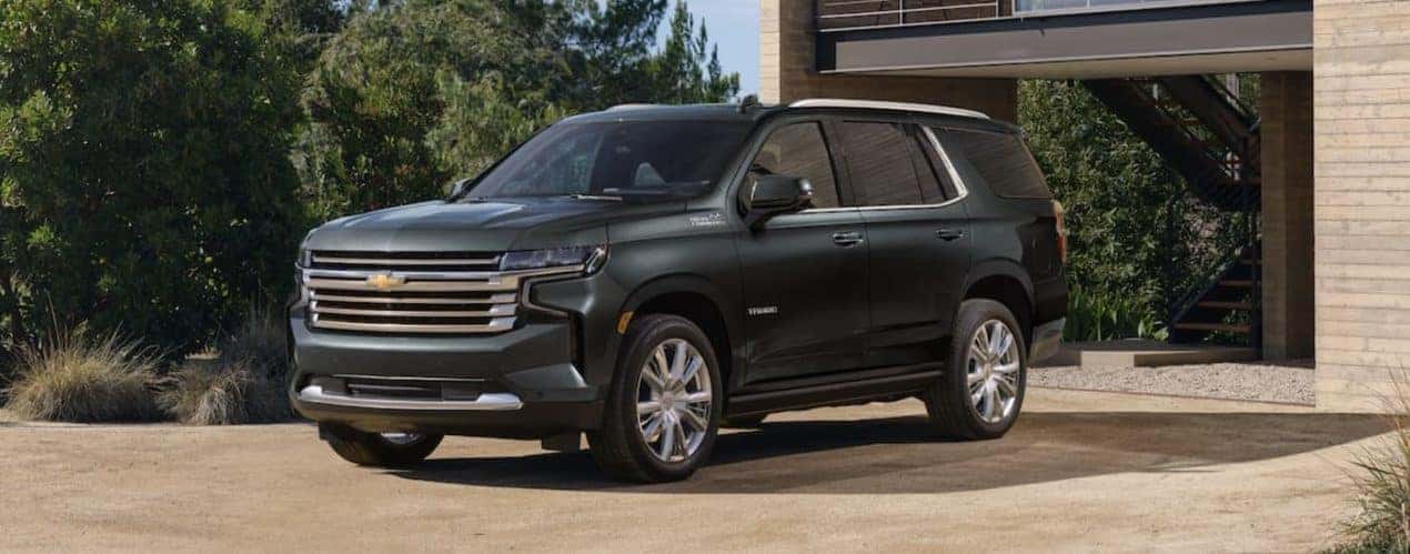 A green 2022 Chevy Tahoe is angled left.