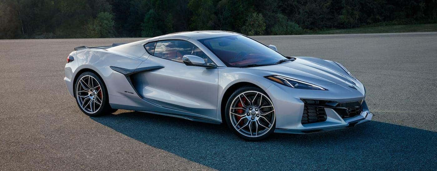 A silver 2023 Chevy Corvette Z06 is shown parked on pavement after leaving an Arab Chevrolet dealership.