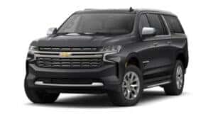 A grey 2023 Chevy Suburban Premier is angled left.