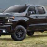 A black 2021 Chevy Silverado 1500 Z71 is shown from the side.