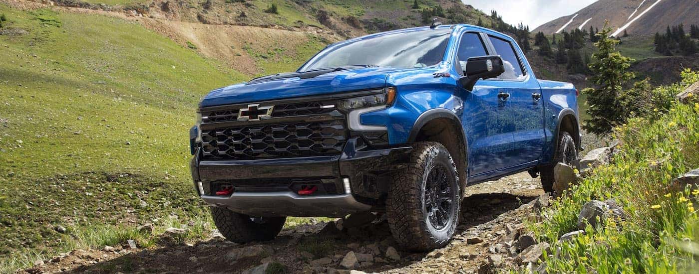 A blue 2022 Chevy Silverado 1500 ZR2 is shown from the front at an angle after leaving a Chevy Silverado 1500 Dealer.