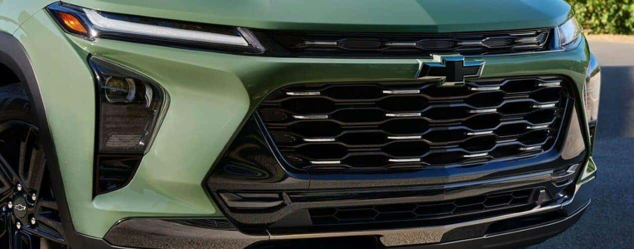 A close up shows the grille on a green 2024 Chevy Trax.