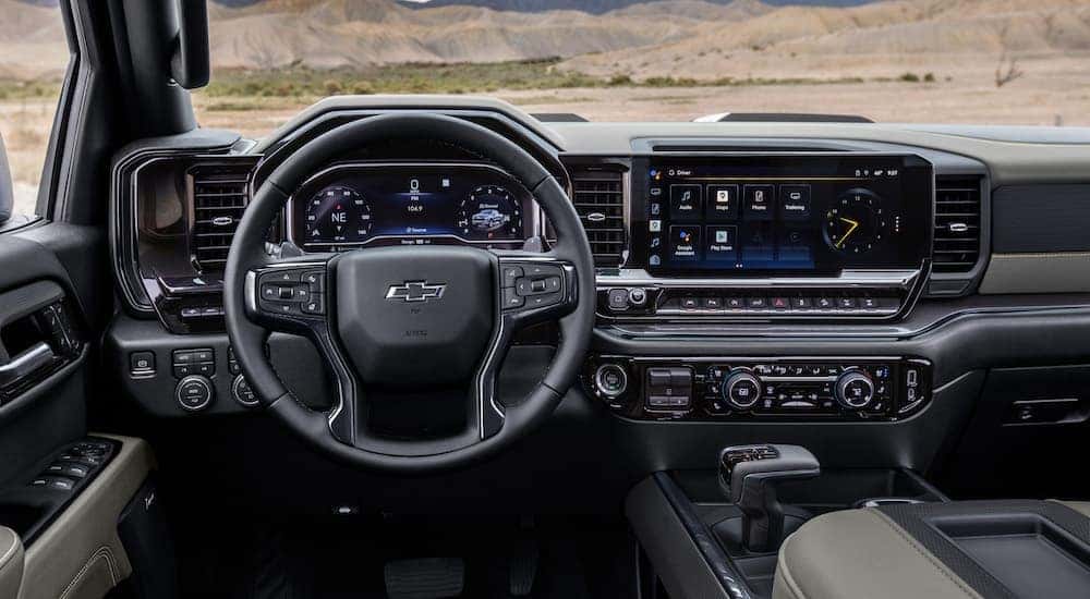 The black interior of a 20224 Chevy Silverado 1500 ZR2 is shown from the driver's seat.