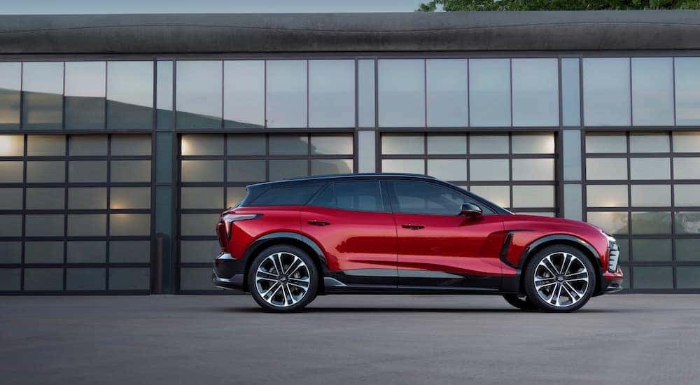 A red 2024 Chevy Blazer EV SS is shown parked near a building.