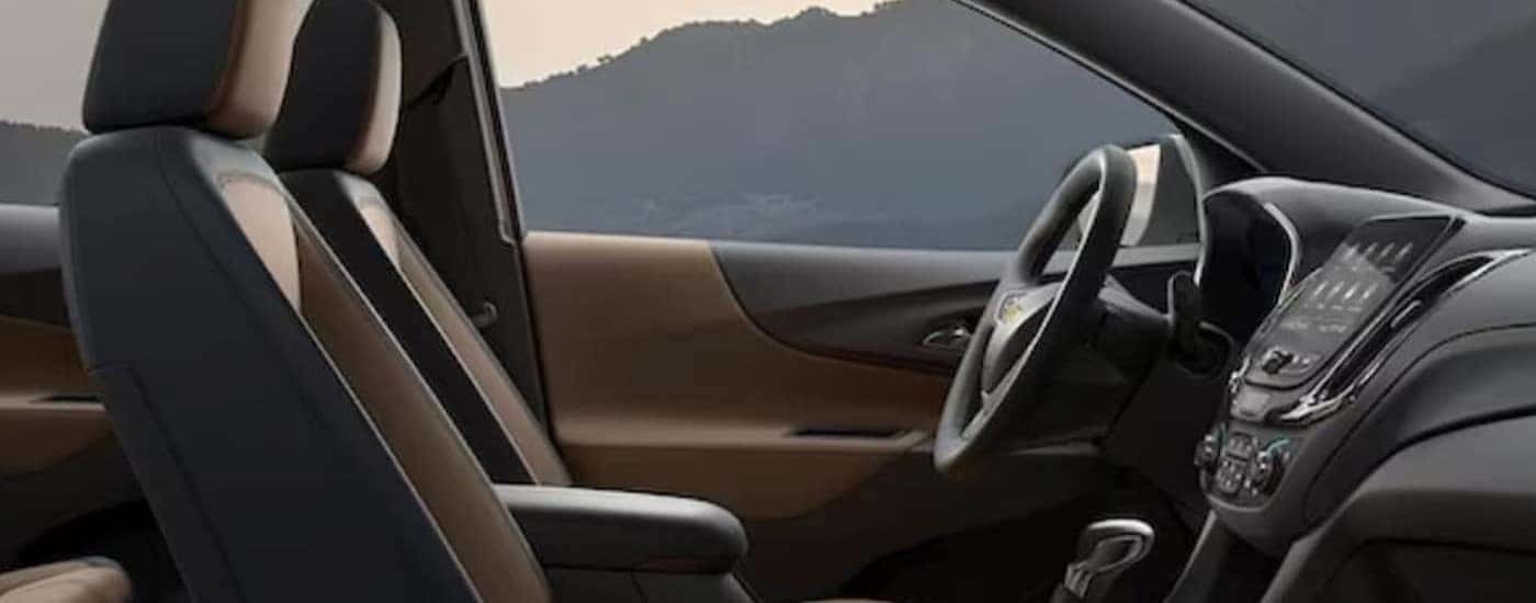 The black and brown interior in a 2024 Chevy Equinox is shown.