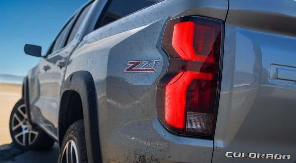 A close up shows the driver side taillight on a grey 2024 Chevy Colorado.
