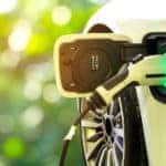 Close up of a car charger plugged into a hybrid or electric vehicle