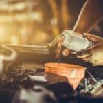Mechanic performing a professional oil change