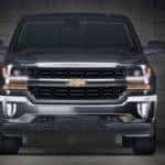 Black 2016 Chevy Silverado truck in a dark garage
