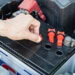 Mechanic working on a vehicle's battery
