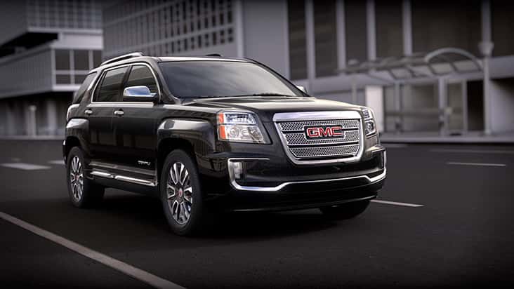 Black 2016 GMC Terrain driving through the city