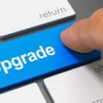 Blue key with the word "Upgrade" on it on a laptop keyboard