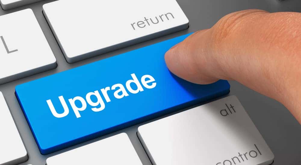 Blue key with the word "Upgrade" on it on a laptop keyboard