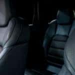 Close-up of leather seats inside a dark vehicle