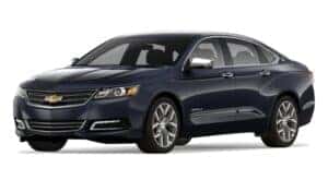 A blue 2016 Chevy Impala is angled left.