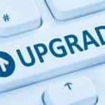 Close-up of a button on a keyboard with the word "UPGRADE" on it