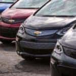 Various colors of the 2017 Chevrolet Bolt lined up in a parking lot