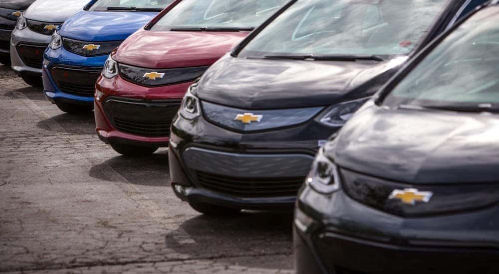 Various colors of the 2017 Chevrolet Bolt lined up in a parking lot