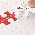 Red empty problem space and white solution puzzle piece