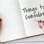 White pages in a notebook with "Things to Consider" written on one of the pages