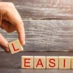 Brown blocked with red letters on them that spell out the word "LEASING"