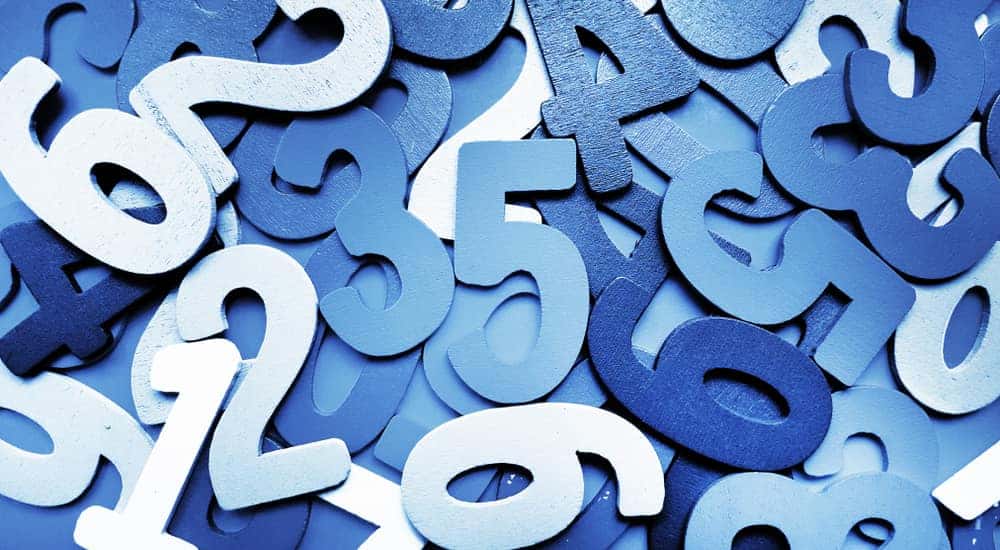 Pile of numbers blue cut out of construction paper