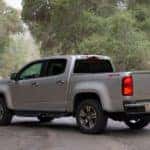 Silver 2018 Chevrolet Colorado parked diagonally across a paved road