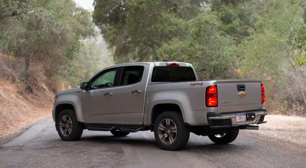 Silver 2018 Chevrolet Colorado parked diagonally across a paved road