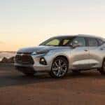 Silver 2019 Chevrolet Blazer Premier SUV parked on dirt in front of a light, clear sky
