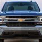 Front view of a blue 2019 Chevrolet Silverado truck in a paved lot