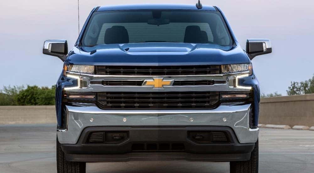 Front view of a blue 2019 Chevrolet Silverado truck in a paved lot