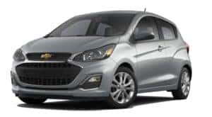 A silver 2020 Chevy Spark is facing left.