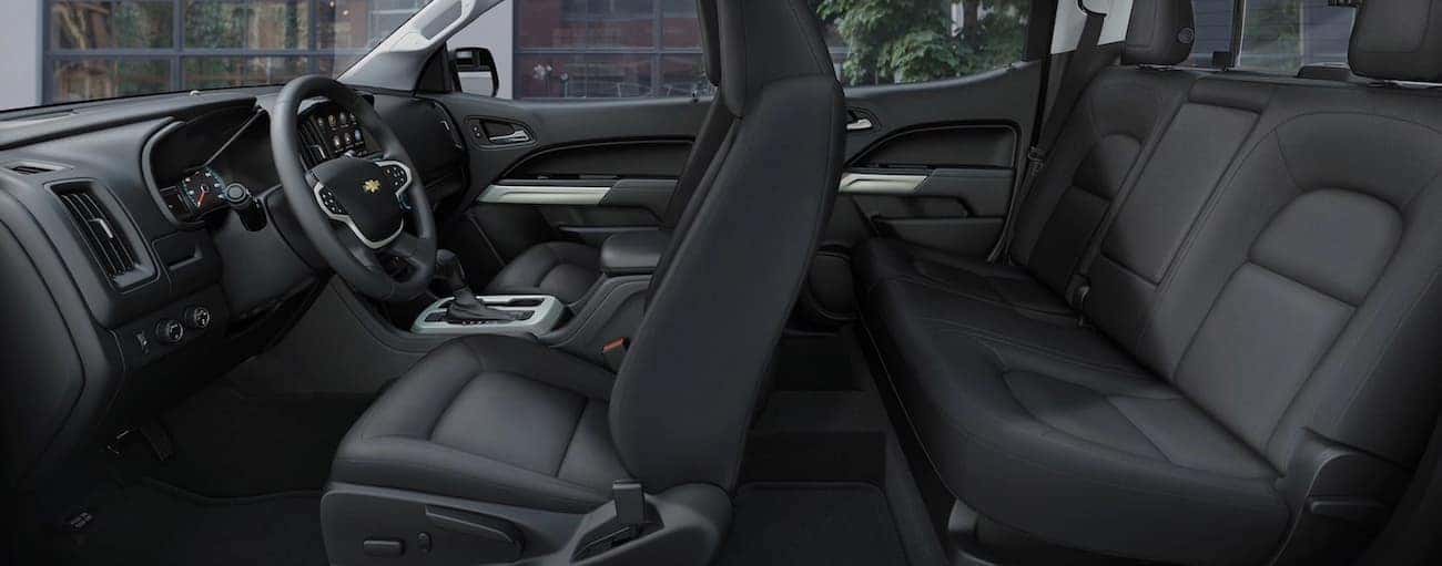 A side view of the black front and rear interior of a 2020 Chevy Colorado is shown.