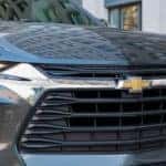 A close up of a blue 2019 Chevy Blazer front grille is shown.