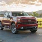 A red 2019 Chevy Silverado 1500 is parked in front of farm land outside of Albany, NY.
