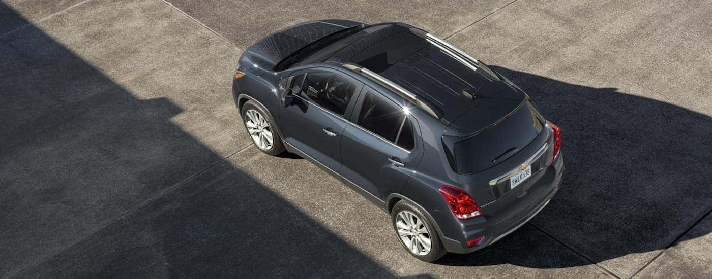 A dark grey 2020 Chevy Trax is shown from above in a parking garage.